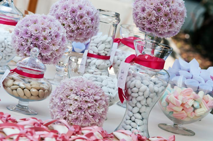 Wedding table with flower balls and sweets